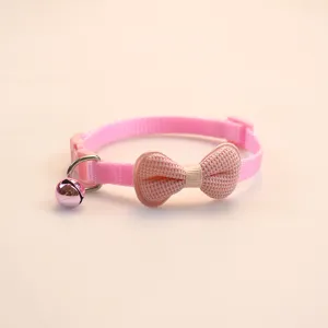 Cute pink pet collar featuring a soft padded bow and a crisp bell, perfect for cats and small dogs.