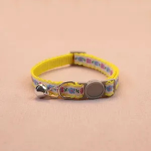 Detailed view of cute floral pet collar with safety buckle and bell for cats and dogs.