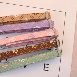Adjustable cute paw print pet collar for small dogs and cats, colorful fabric neck strap.