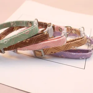 Adjustable pet collar with cute paw print pattern for cats and small dogs, daily wear main image.