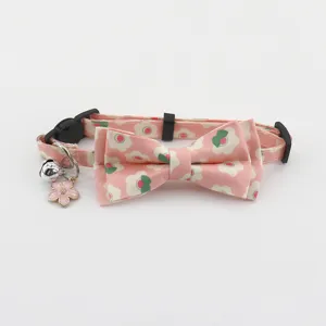 Pink floral cat collar with cute bowknot bell and cherry blossom charm for small pets.