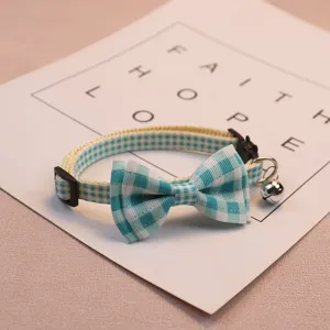 Cute blue plaid pet collar with bowknot and bell, adjustable safety strap for cats and small dogs.