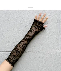 Detail view of black lace fingerless sun protection gloves, showing delicate floral mesh texture.
