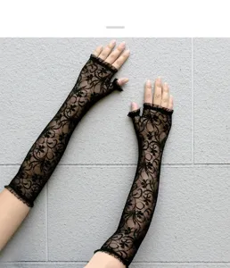 Detailed shot of black lace fingerless sun protection gloves, showing delicate floral mesh texture.