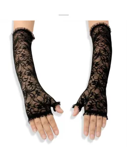 Detailed shot of black lace fingerless gloves featuring intricate floral patterns and delicate ruffles.