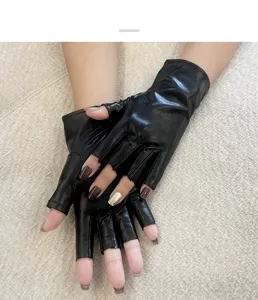 Black patent leather fingerless gloves detail, stylish shiny short stage performance wear.