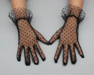 Detailed view of black sheer mesh polka dot gloves featuring delicate frilly cuffs.