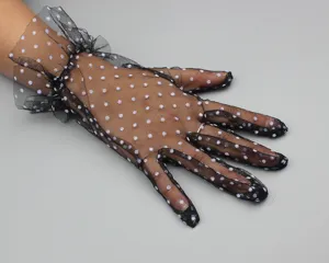 Detailed shot of black sheer mesh polka dot short gloves with frilled cuffs for women elegance.