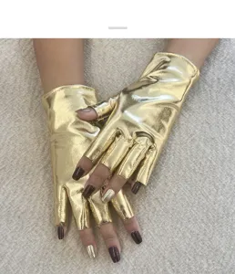 Detail view of shiny gold metallic fingerless gloves, perfect for stage performance or parties.