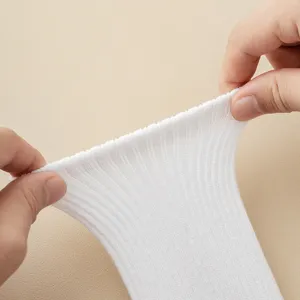 Close up view of the white ribbed sock texture, demonstrating excellent stretch elasticity.