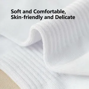 Close-up detail of white cotton ribbed athletic socks, soft and breathable fabric texture.