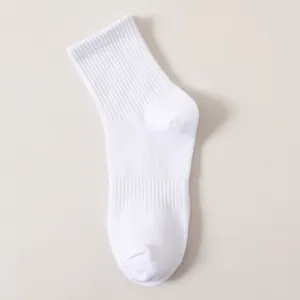 Detailed view of plain white cotton crew sports sock, showcasing soft texture and knit.
