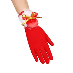 Christmas red plush gloves for women with cute bell bow design, holiday festive wear.