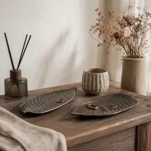 Leaf-shaped metal jewelry tray ring dish and key holder for home decor, tabletop entry organizer.