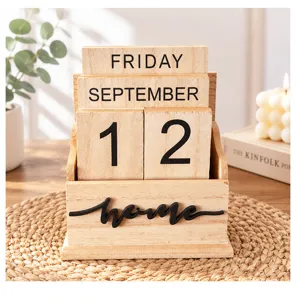 Detail shot of wooden perpetual calendar desk ornament with custom date blocks and home decor.