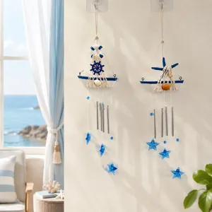 Mediterranean style sailboat wind chime with metal tubes and blue star pendants for home decor.