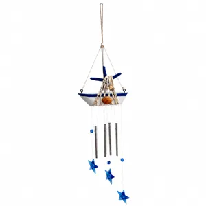 Mediterranean sailboat wind chime with blue stars and metal tubes for home and room decor.