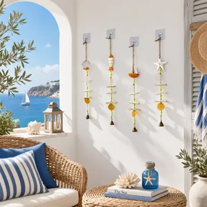 Mediterranean wind chime hanging decor with shell and sailboat elements for home balcony.