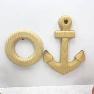 Detailed view of blank DIY craft anchor and lifebuoy wall decor ready for hand painting.