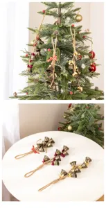 Vintage iron Christmas hanging bells with hemp rope and bows for festive holiday party decor.