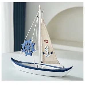 Mediterranean wooden sailboat model detail, creative nautical home decor tabletop ornament.