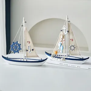 Handmade wooden sailboat model with Mediterranean design, ideal for home tabletop decor.