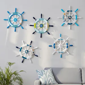 Mediterranean style wooden ship wheel wall hanging detail view showing nautical decor elements.