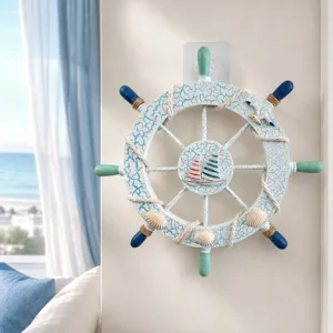 Detailed view of the 28cm nautical wooden ship wheel wall decor with crackle finish and marine charms.