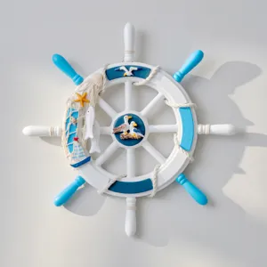 Detail shot of wooden nautical wheel wall decor with Mediterranean style blue and white paint.
