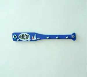 Mediterranean wooden paddle wall hook detail view, nautical home decor hanging accessory.