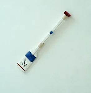 Mediterranean style wooden paddle wall hook detail, nautical decor hanging piece.