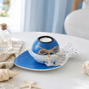 Nautical style fish tray candle holder set with blue and white speckled spherical tealight decor.