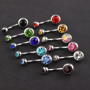 Stainless steel curved belly button ring detail featuring colorful sparkling cubic zirconia stones.