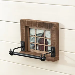 Rustic wooden wall-mounted toilet paper holder with metal hardware and barn picture.