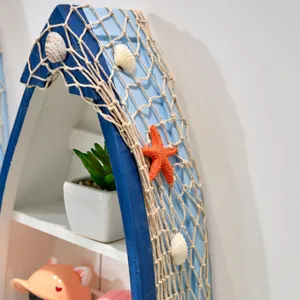 Mediterranean nautical boat shelf decor with fishing net and seashells for home display