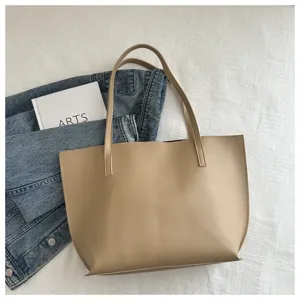 Vista dettagliata della borsa tote in pelle PU minimalista, con cuciture pulite e grande capacità.