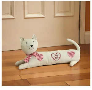 Close-up detail of the fabric cat doorstop, cute home decorative stopper made of soft linen material.