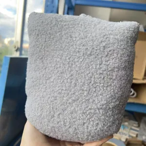 Cuscino fermaporta in pile grigio, tessuto morbido anticollisione per decorazione.
