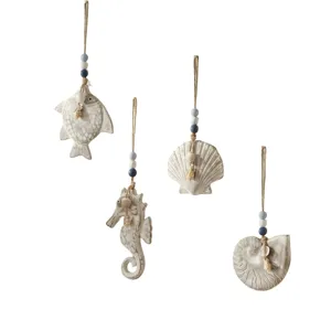 Mediterranean style nautical wooden hanging ornaments set featuring fish seahorse and shell shapes.