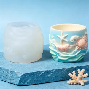Detail view of ocean wave silicone mold and finished desktop storage holder with seashell relief.