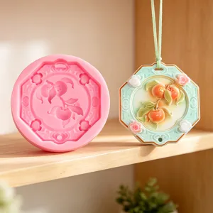 Chinese style peach flower relief silicone mold and plaster aromatherapy pendant detail view.