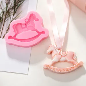 Close up of the cute rocking horse silicone mold and finished epoxy pendant detail view.
