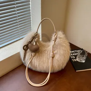 Fluffy plush hobo shoulder bag for women, cozy winter faux fur crossbody handbag chic.