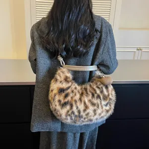 Leopard plush shoulder bag for women, trendy fluffy crescent hobo bag for autumn commuting.