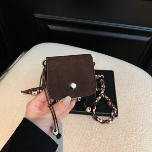 Mini suede crossbody bag for women, stylish little lipstick pouch with chic drawstring and beads.