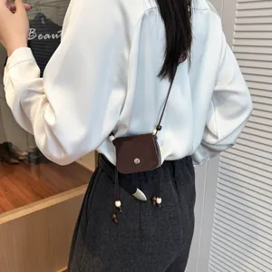 Chic mini crossbody bag for women, stylish brown small shoulder bag with beaded cords.