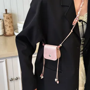 Exquisite mini crossbody bag with chic beaded strap, perfect trendy accessory for daily outfits.