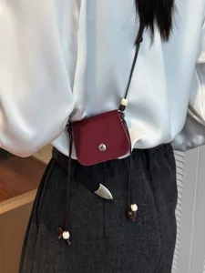 Chic mini crossbody bag for women, stylish red small shoulder bag for outdoor daily use.