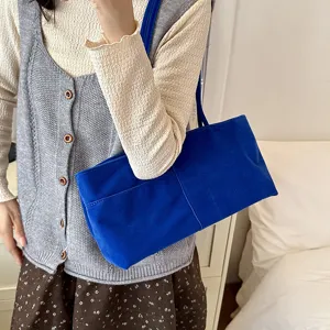 Blue velvet shoulder bag for women, casual lightweight tote bag for commute and travel.