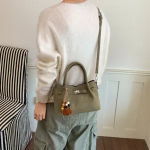 Olive green suede shoulder crossbody bag for women, chic niche design, perfect for autumn.